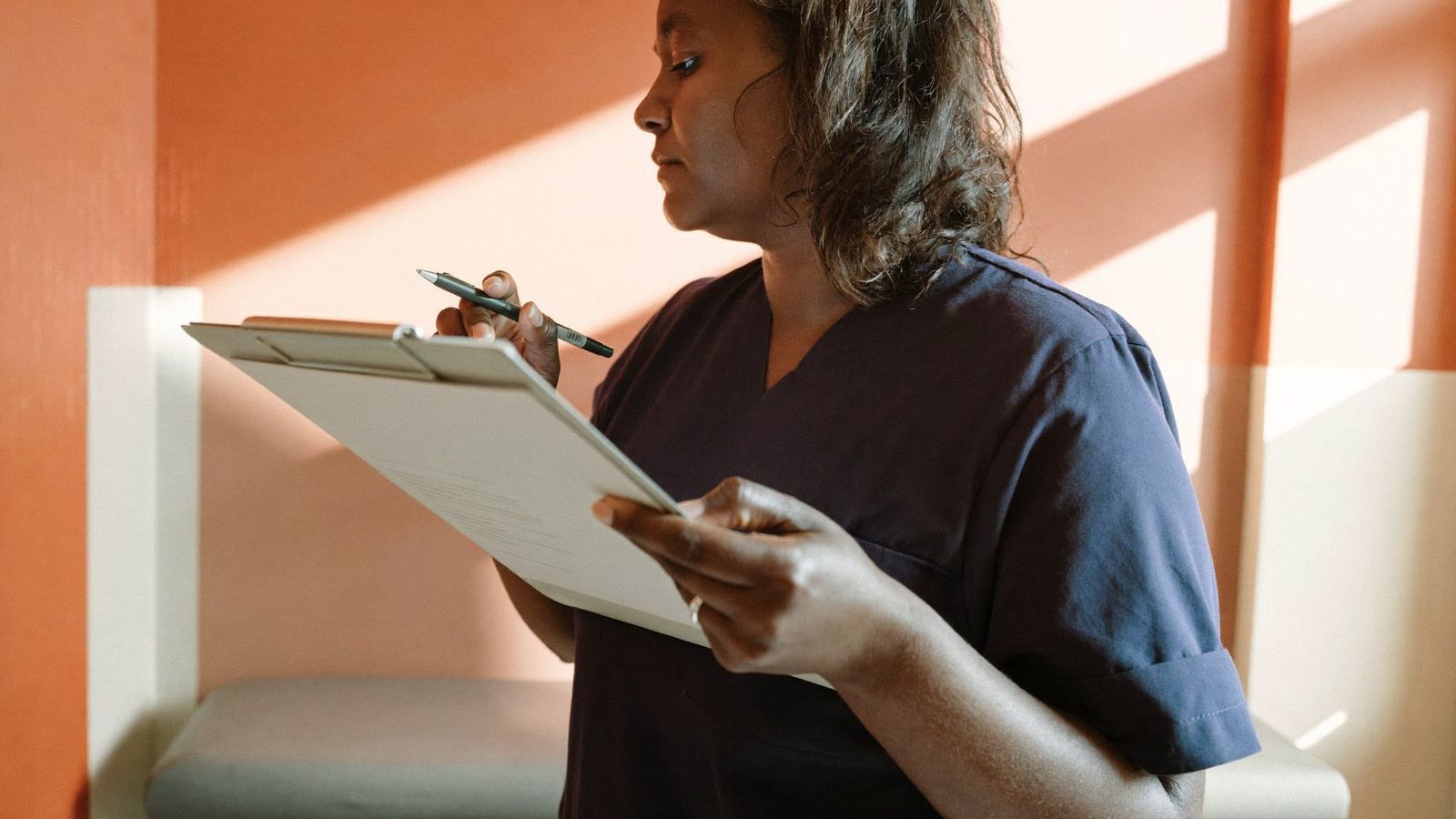 Nurse reviewing a chart